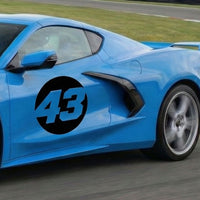 Pair of black hollow racing numbers decals for cars, featuring "show-through" style B design by MC Motoparts.