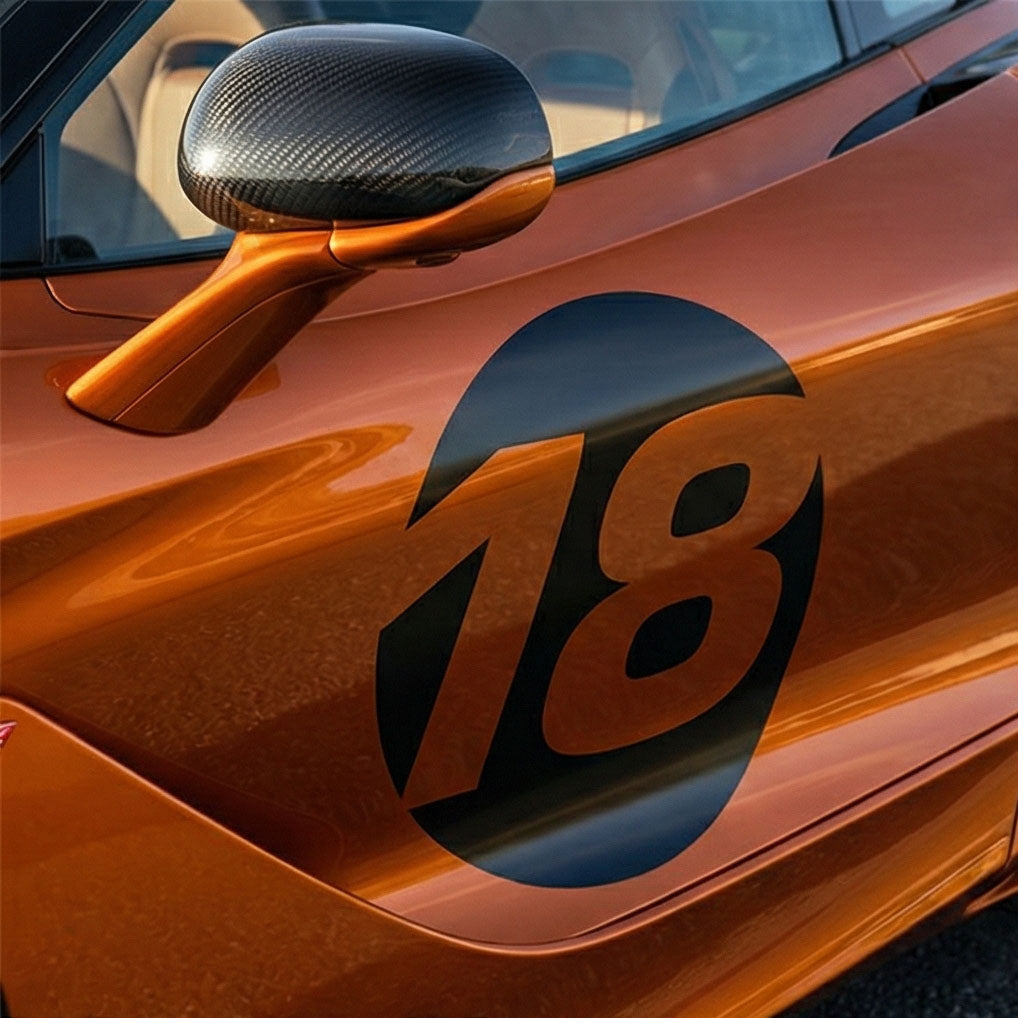 Pair of black hollow racing numbers decals with cut-out font, designed for race cars, from MC Motoparts, style C.