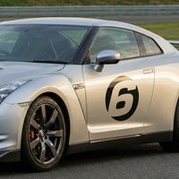Pair of black hollow racing numbers decals for cars, style C, showing "show-through" design on a race car sticker by MC Motoparts.