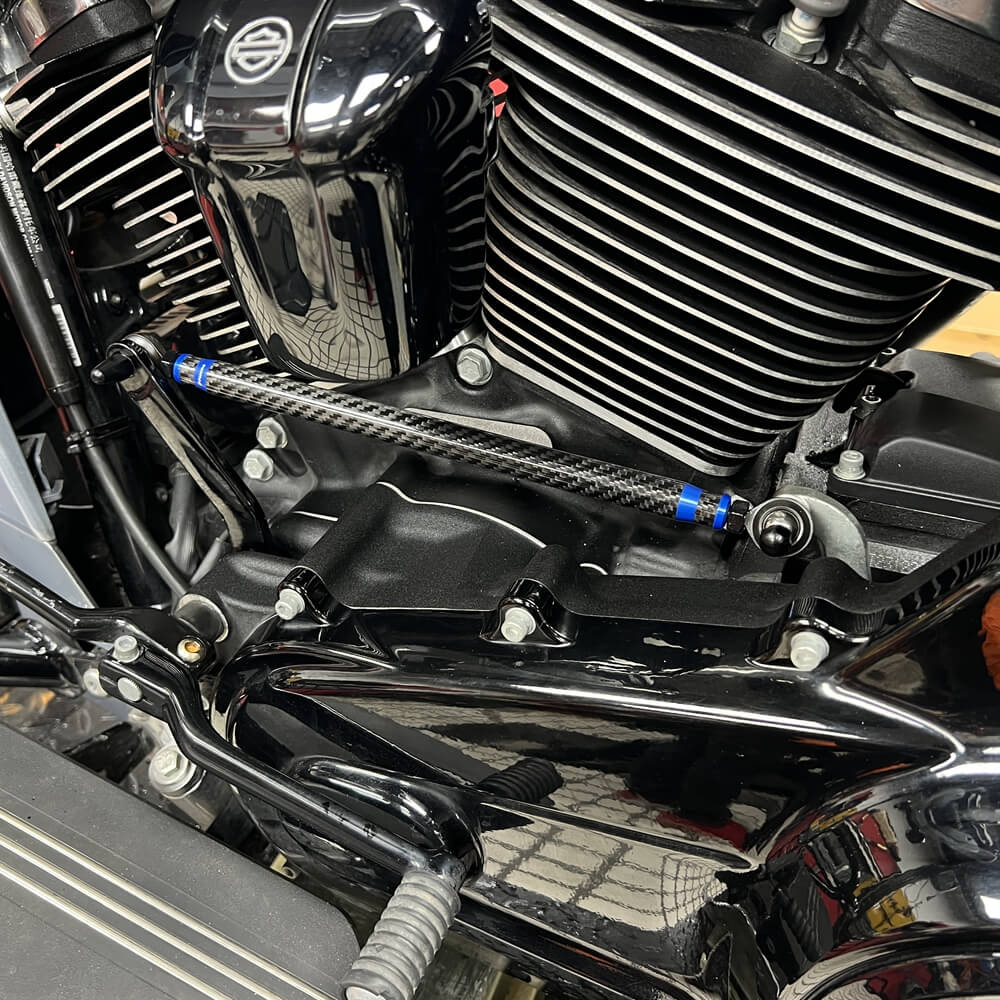 Carbon fiber adjustable Harley touring shifter linkage by Pazoma, CNC billet aluminum, no-slop shifting, fits Harley models 1986-2026.