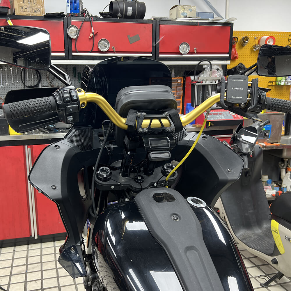 Pazoma waterproof motorcycle handlebar bag with tactical design mounted on a Harley Softail Dyna Sportster for secure storage.
